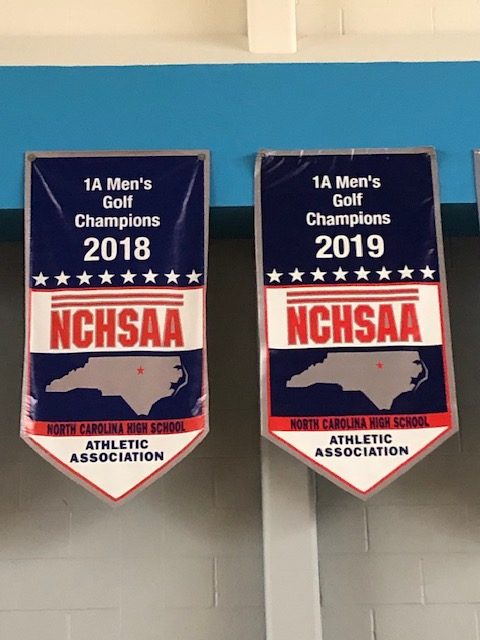 Mens Golf 2018 and 2019 Championship Banners hang in CSDs High School Gym