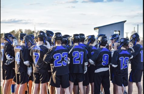 Photo Taken By Lilly Asano
Mens Lacrosse team huddles up before a big win against PLP.