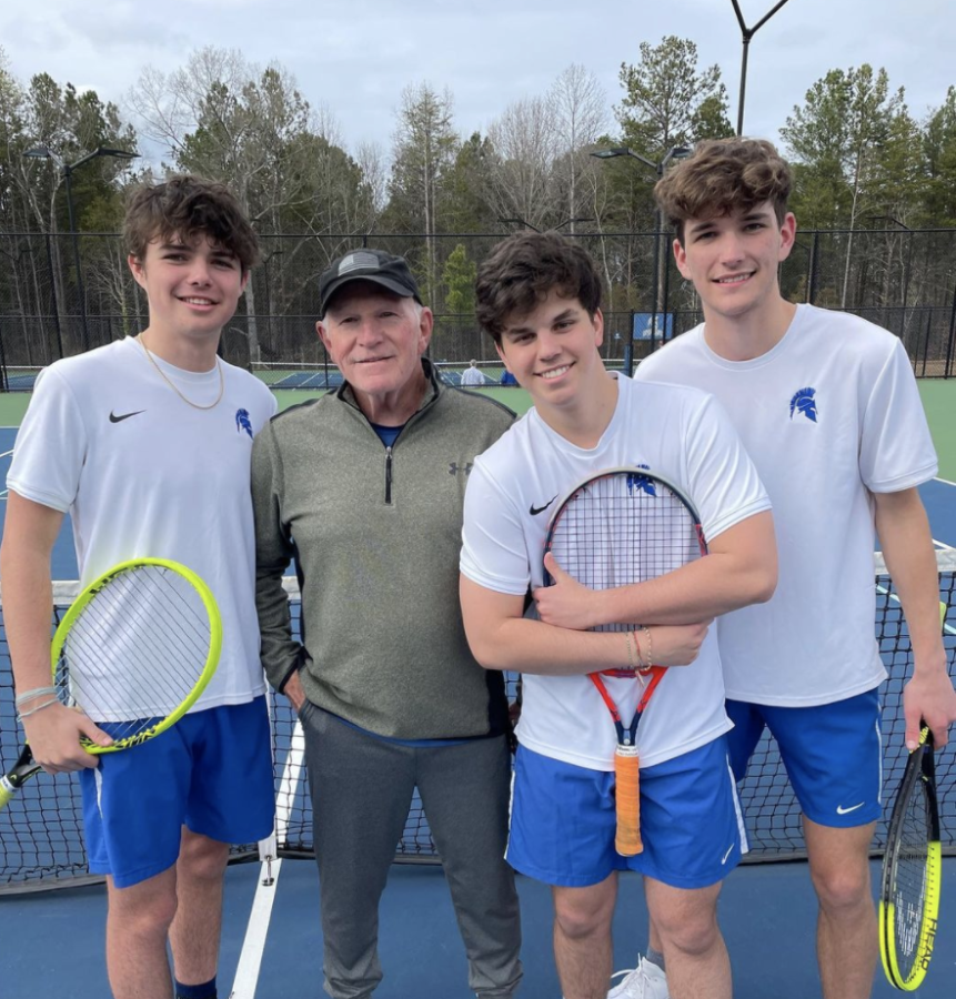 Senior tennis players (left to right) Thomas Magryta, Coach Colin, Julian Rizo, and Riley Klebe. Photo taken by Jennifer Chaffman.