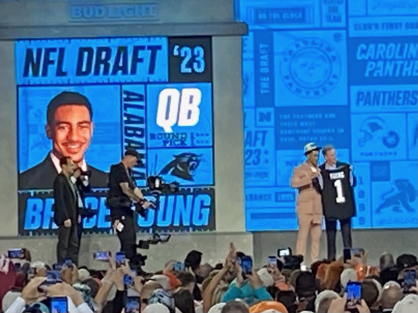 The 2023 NFL draft’s first overall pick, Bryce Young, stands onstage with the commissioner on draft day in Kansas City.
