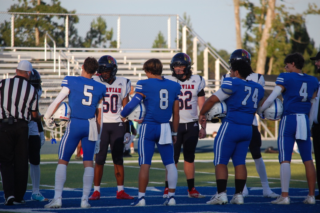 CSD Spartan football captains, Brandon Albert (#5) and Tanner Mullins (#4), represent as two of the four football captains.
