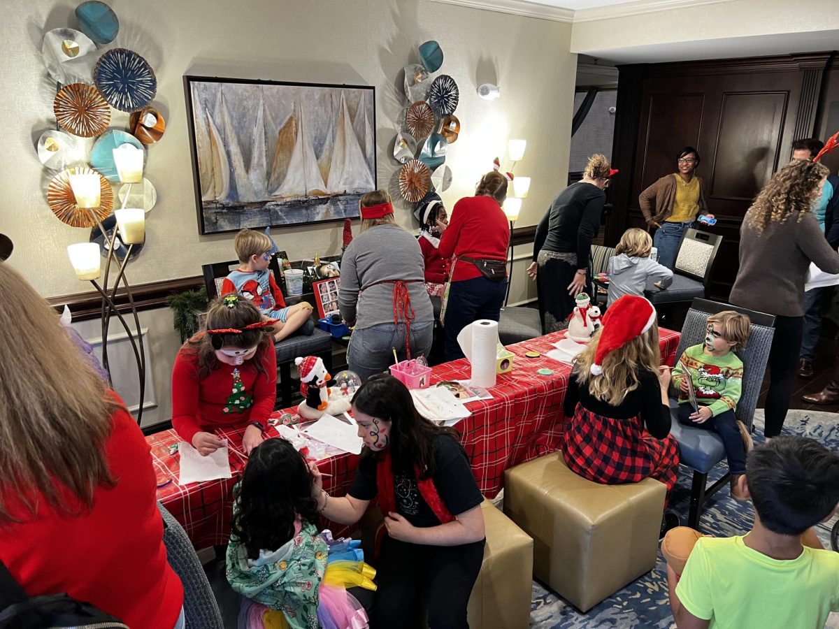 On day three of the Christmas in Davidson celebration, Girl Scout Troop 1924 painted the faces of the children (and each other) who attended a Breakfast with Santa event at the Homewood Suites hotel. 

