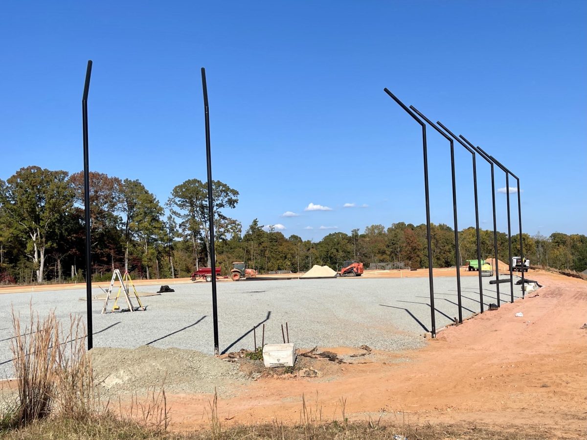 by late October 2023 the field was beginning to take shape with backstop fencing and the infield foundation in place.