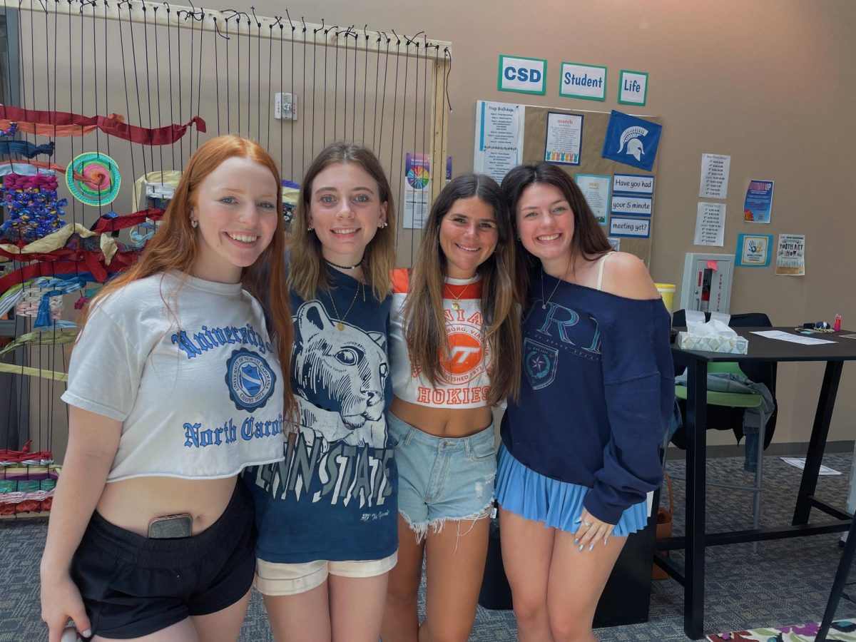 Pay attention underclassmen, Ava Jordan (right) and her graduating classmates have advice for your upcoming senior year.