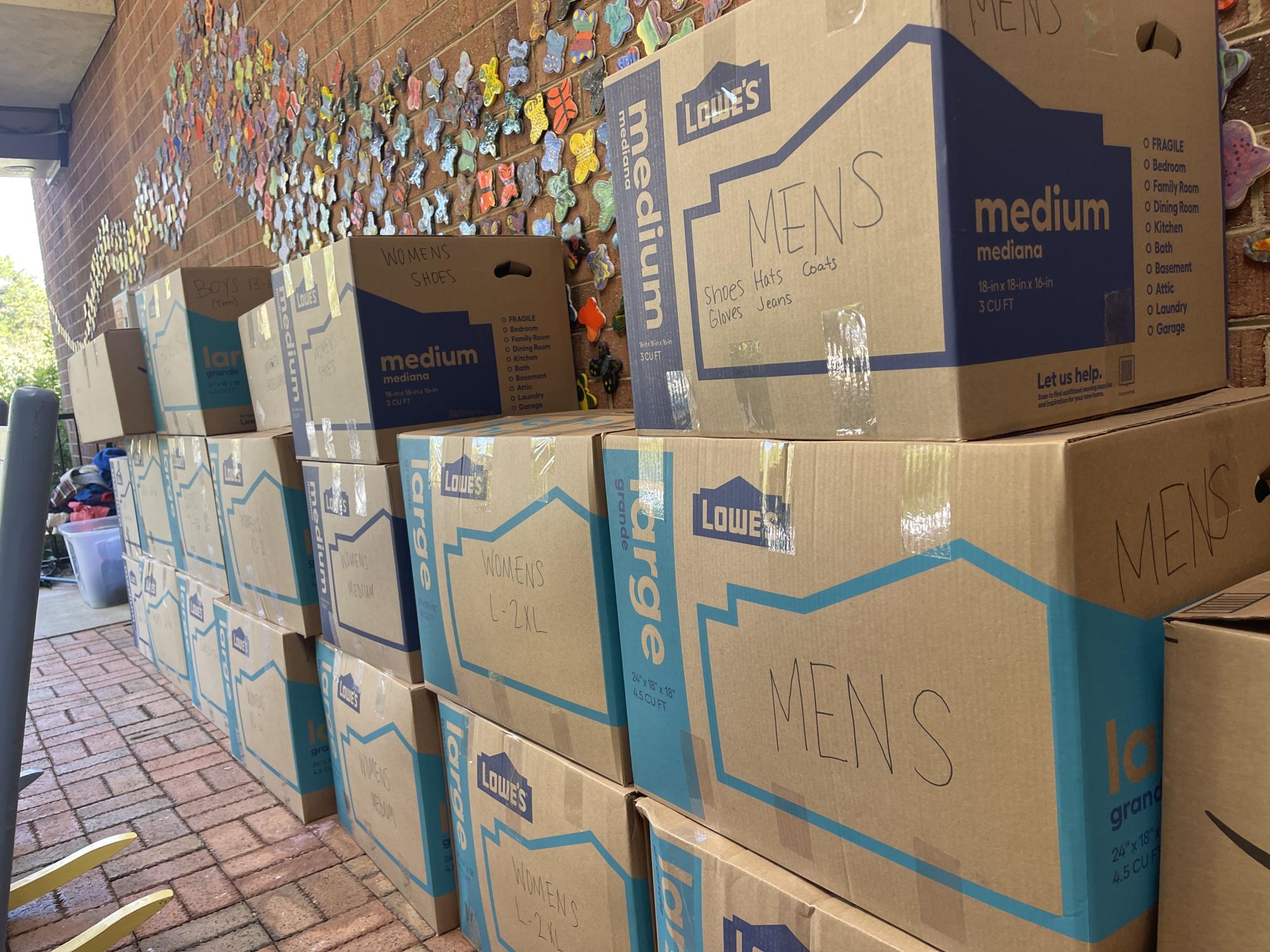 Donations of clothing for Hurricane Helene Relief collected by CSD families await delivery to Western North Carolina on the outdoor patio at the CSD lower school. Boxes of clothes for men, women, and children are all set up for anybody who wants to donate. (CSD Journalism class photo.)
