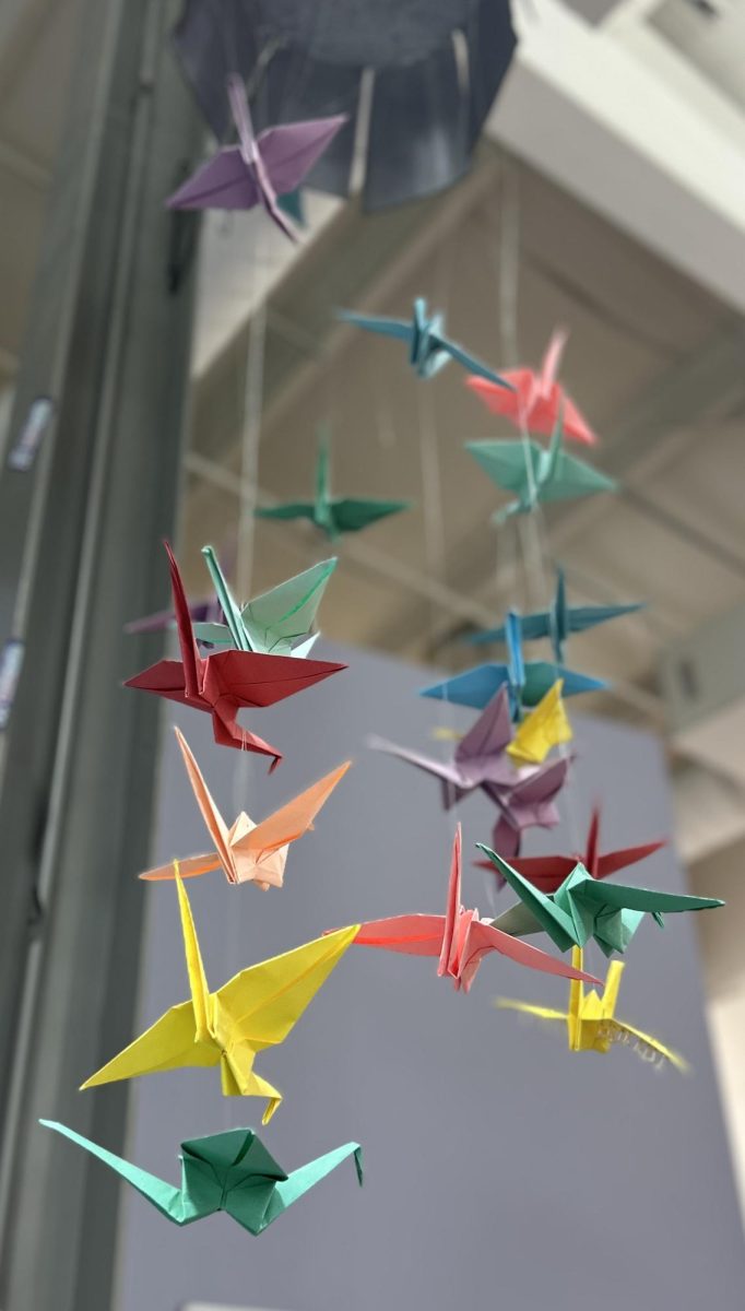 Origami birds hang on display in CSD’s Arts Commons. Though they may look different, they are, to a degree, the same. Or are they?