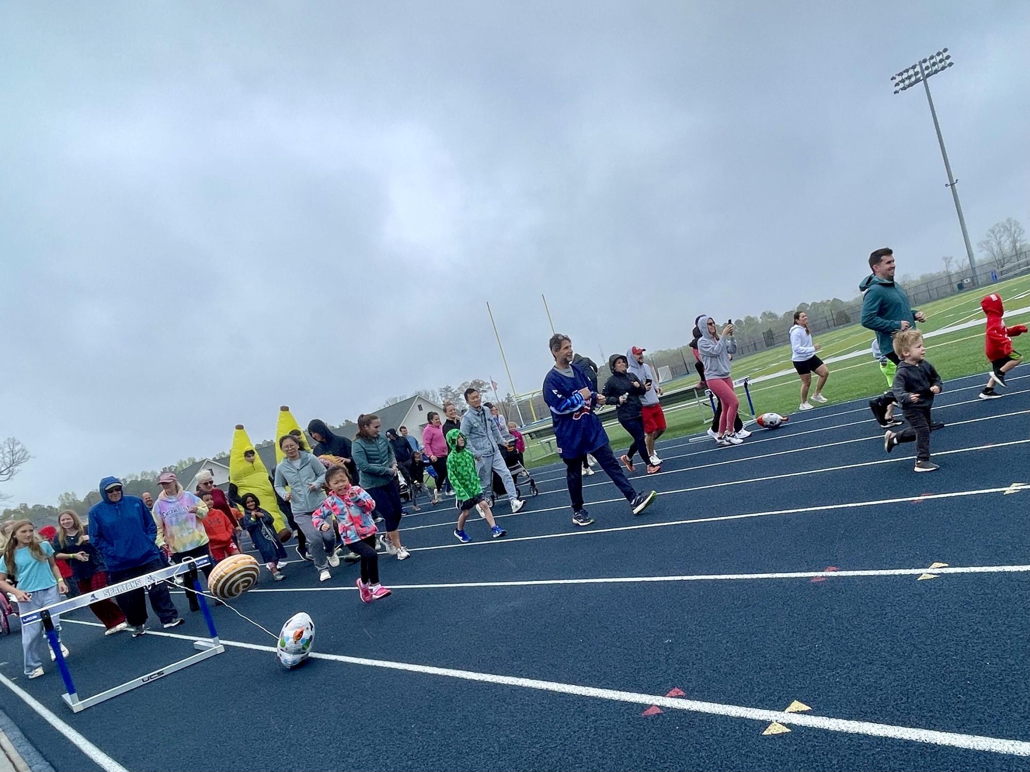 Event participants of all ages begin the 2024 “The Sweet Fun Run” at CSD’s Spartan Park. The event welcomes participants of all ages to run, walk or roll four laps on the track enjoying a sweet treat in between each one. (Photo courtesy of The Sweet Fun Run club.)