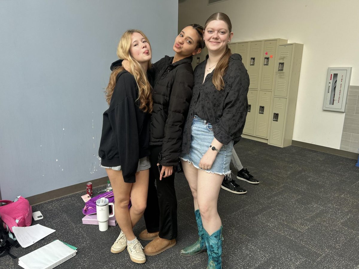 (From left to right) Sarah Bush (‘25), Sinclair Berry (‘25) and Wesley Little (‘25) pose on Learning Street in their chic school outfits. While many students think CSD does not have a dress code, the school does, and it empowers students to make their own wise choices