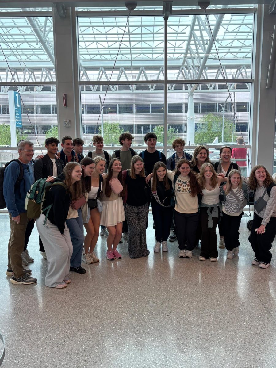 CSD’s Europe ‘25 travelers share a smile at the Charlotte Douglas international Airport. Across eleven days, the group visited 5 different cities and countries in Europe, including Dublin, Wales, London, Paris, and Amsterdam. 
