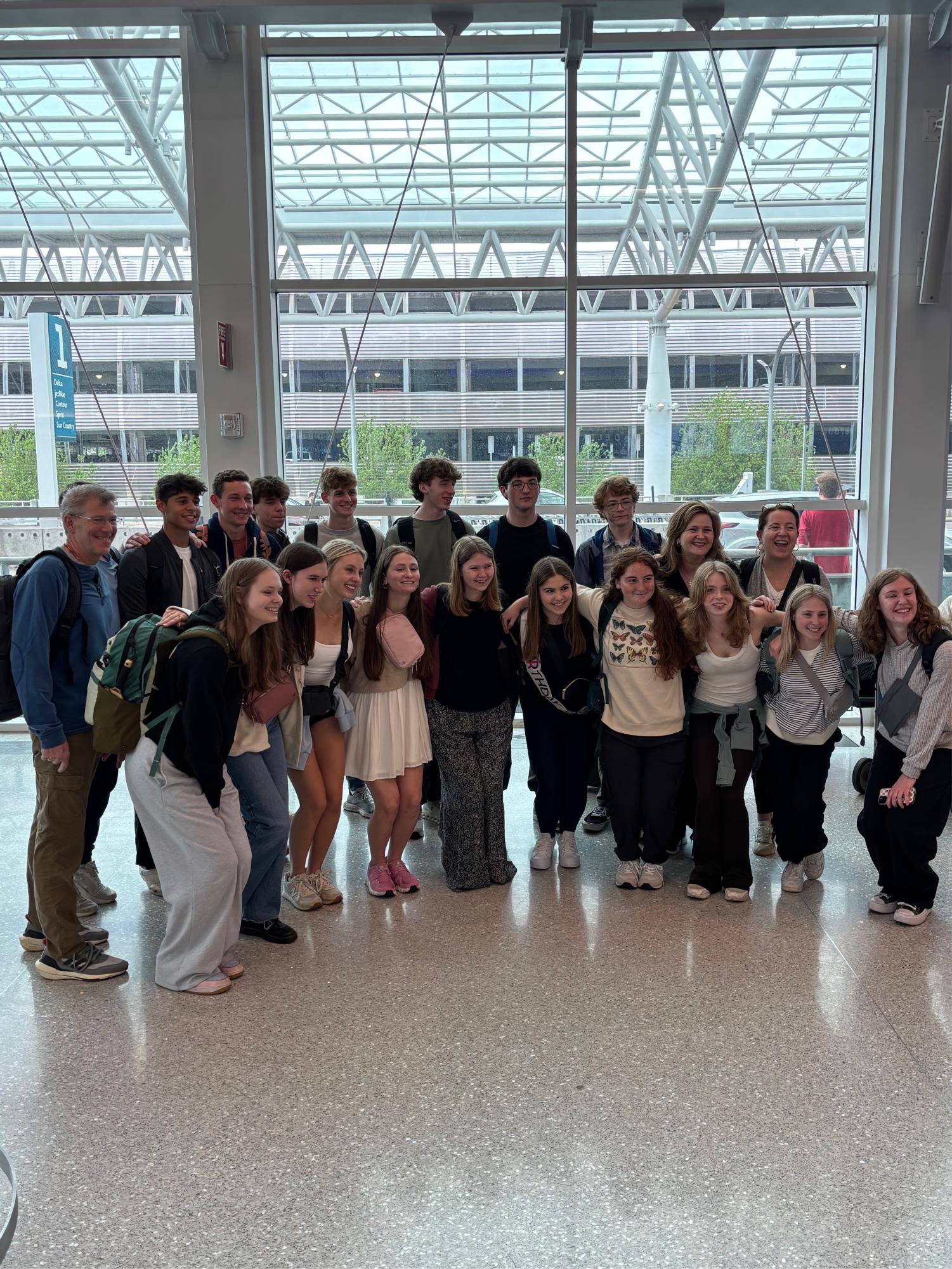 CSD’s Europe ‘25 travelers share a smile at the Charlotte Douglas international Airport. Across eleven days, the group visited 5 different cities and countries in Europe, including Dublin, Wales, London, Paris, and Amsterdam. 
