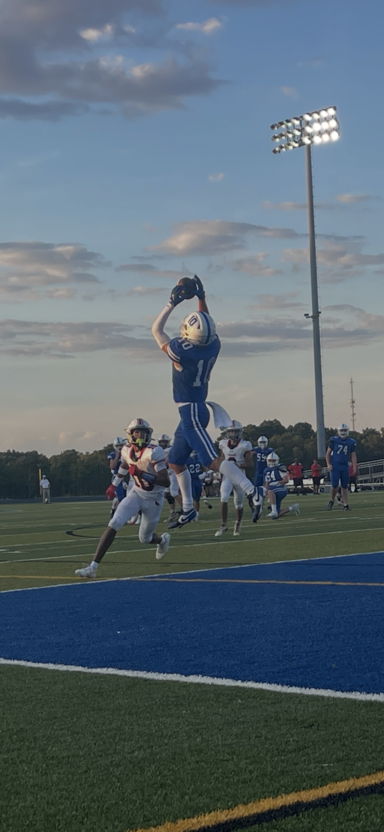 Senior receiver Sam Mack (‘26) catches CSD’s first home touchdown of the game against South Mecklenburg. Despite the loss, Mack’s touchdown was a good sign for the Spartans offense to begin the season. (CSD Journalism class photo.)