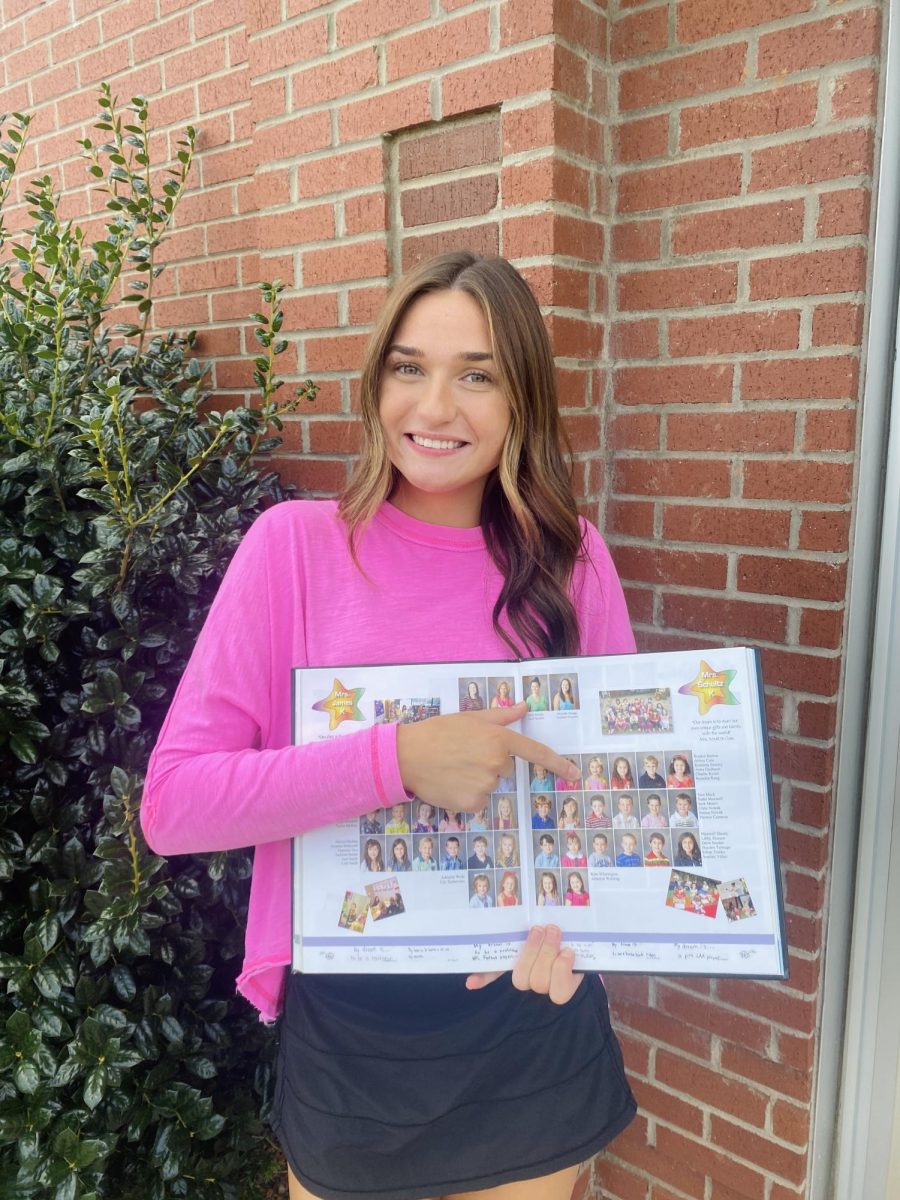 CSD senior “Lifer” Kennedy Donley (‘26) looks back at her kindergarten yearbook photo. Nearly 50 seniors have shared a journey that began at age five.