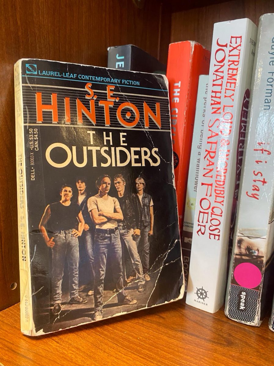 S. E. Hinton's book, The Outsiders, rests on a shelf in the AP Language classroom. The novel, which was published on April 24th, 1967, still holds value today. It is widely considered one of the best “coming-of-age” novels of all time, and it is noteworthy that the characters had to ‘come of age’ without parental guidance. 