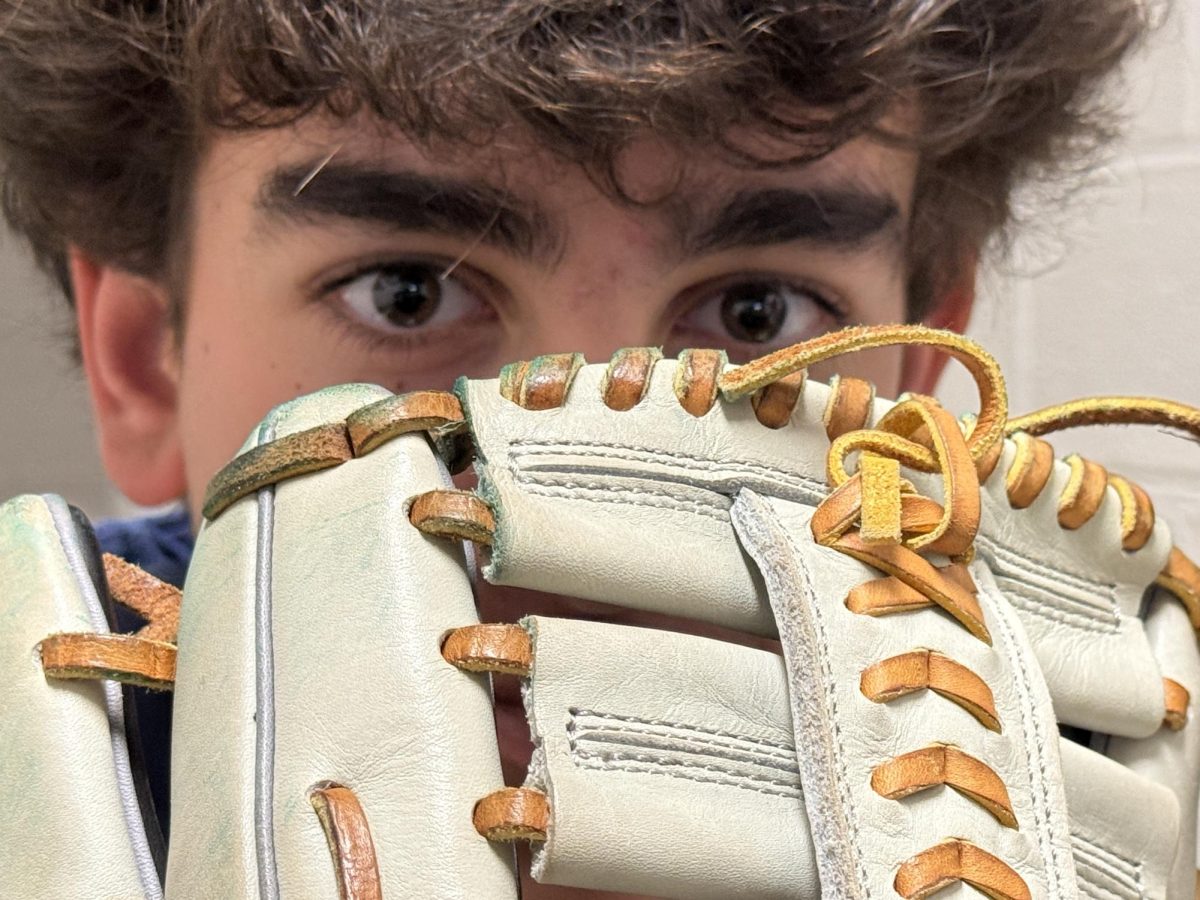 Dylan Sherman (‘28) focuses from behind a baseball glove signifying the upcoming baseball season for spring sports of 2026. Sherman begins his second season on the team as a JV/Varsity role player.
