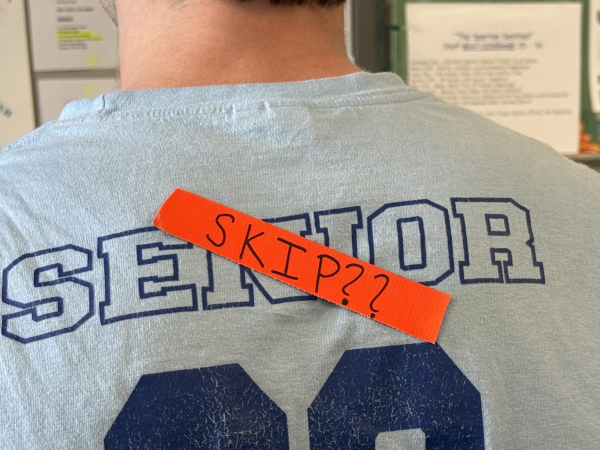 Senior, Maxwell Shealy (‘26), in his first day of school Class of ‘26 t-shirt, wears an orange “skip” label. Although not sanctioned by the school, many members of the senior class added a skip day to their school calendar the week after spring break. Opinions vary on whether it should be official or unofficial.
