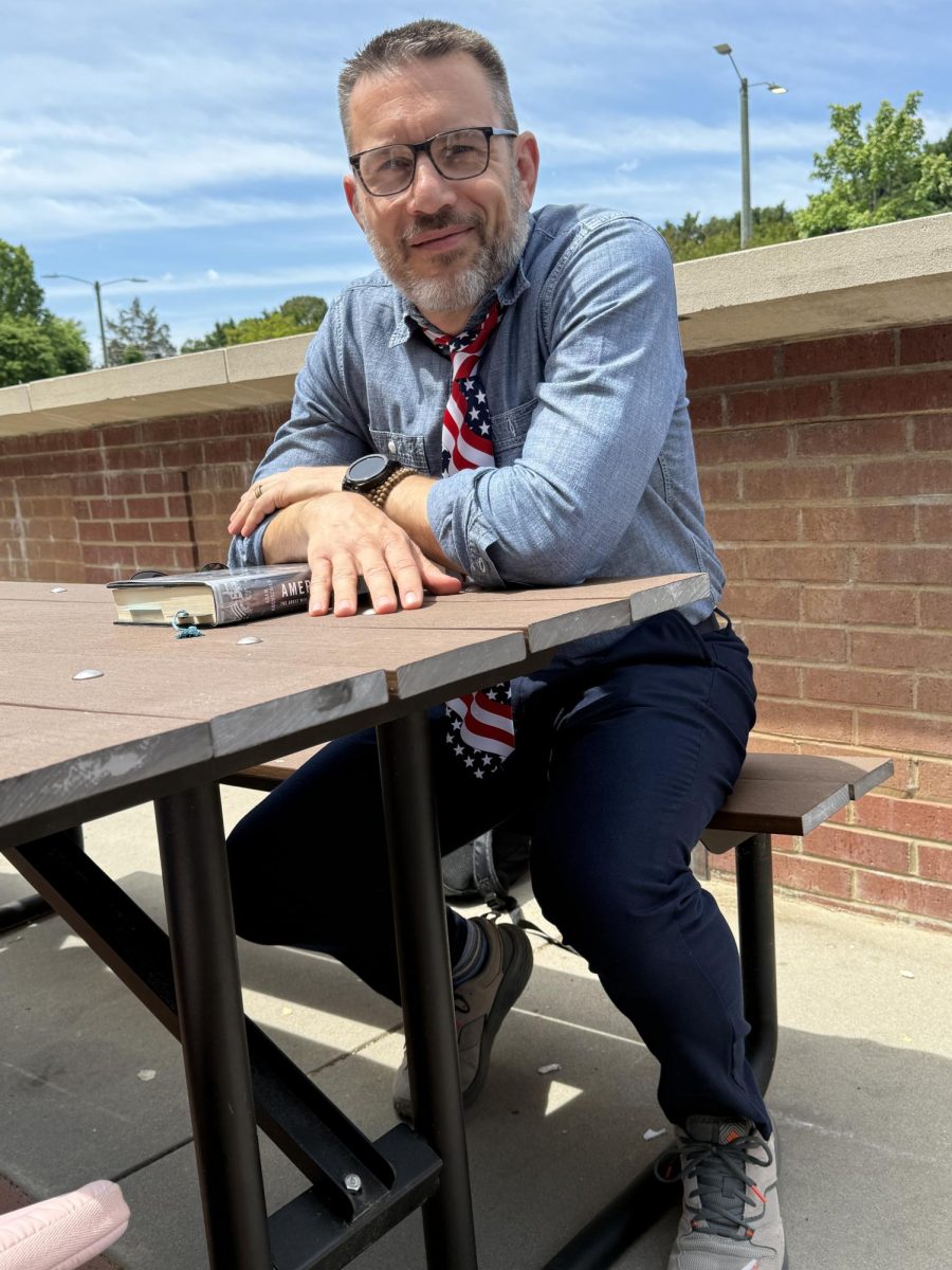 Anthony Yodice, APUSH, APGOV and US History teacher, sits outside during a warm spring afternoon. Every year for his classes, he reacts and describes the Lincoln assassination.